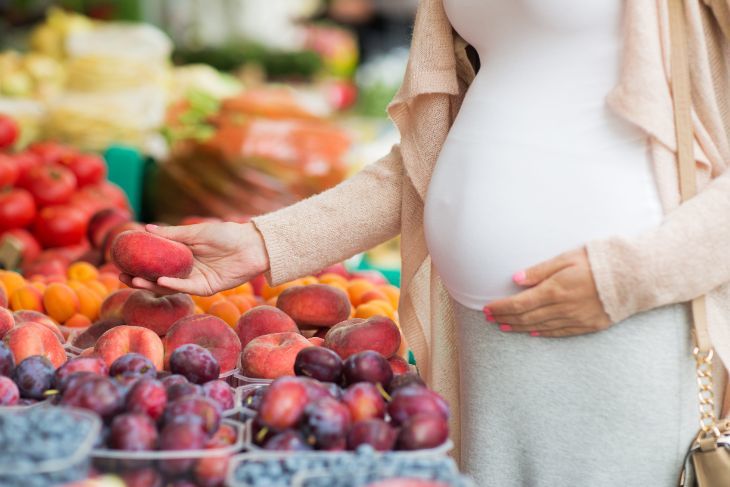 Pregnant Women Picking Fruit